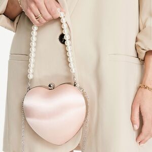 True Decadence Exclusive heart clutch bag in pink satin with faux pearl handle